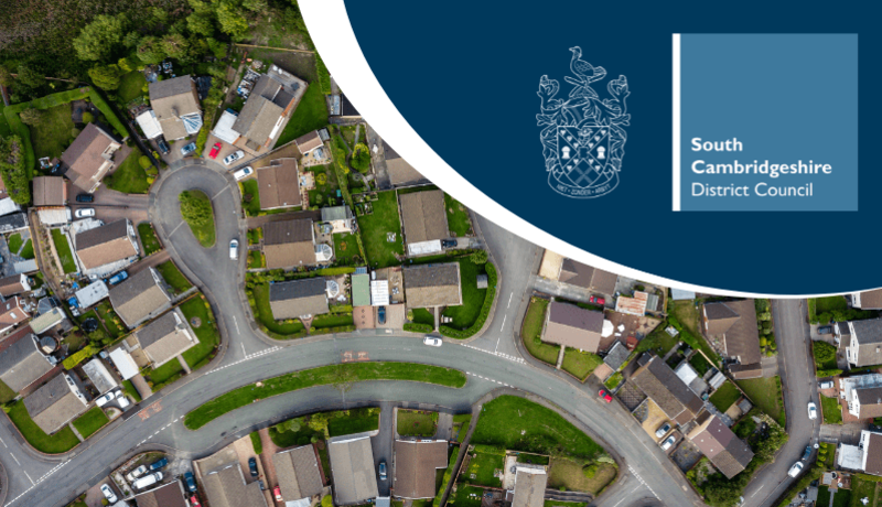 Aerial view of residential neighbourhood with the South Cambs logo
