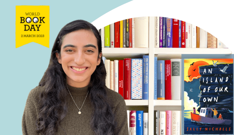 Girl smiling in front of book case