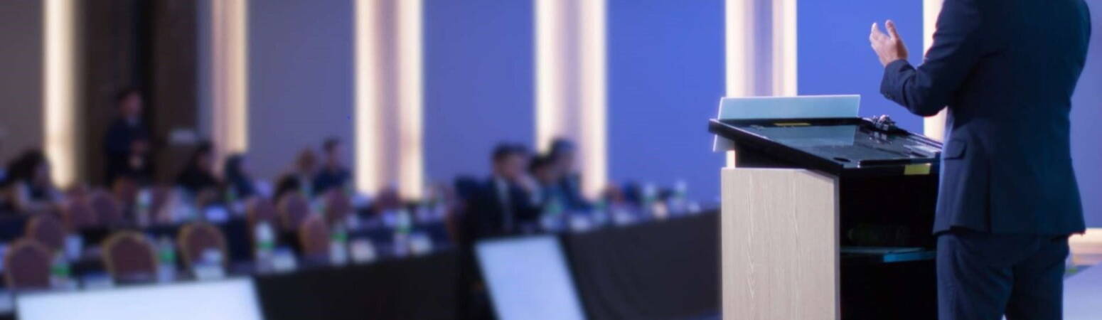 Man giving a speech at conference