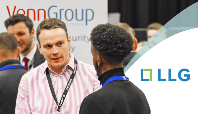Male recruiter speaking to conference delegate